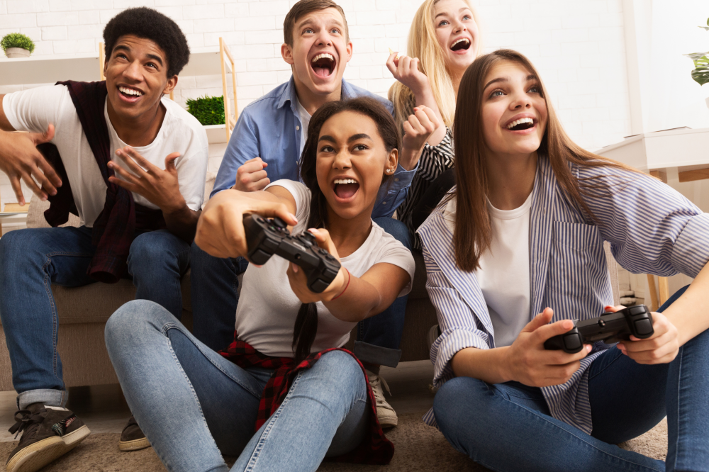 a group of people of different races playing video games together