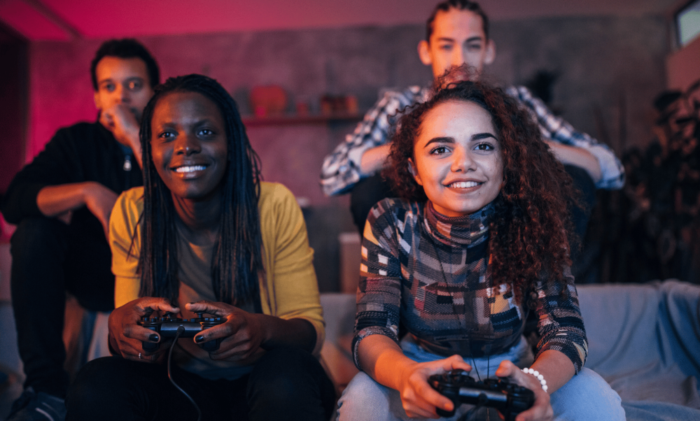 2 males and 2 females playing video games