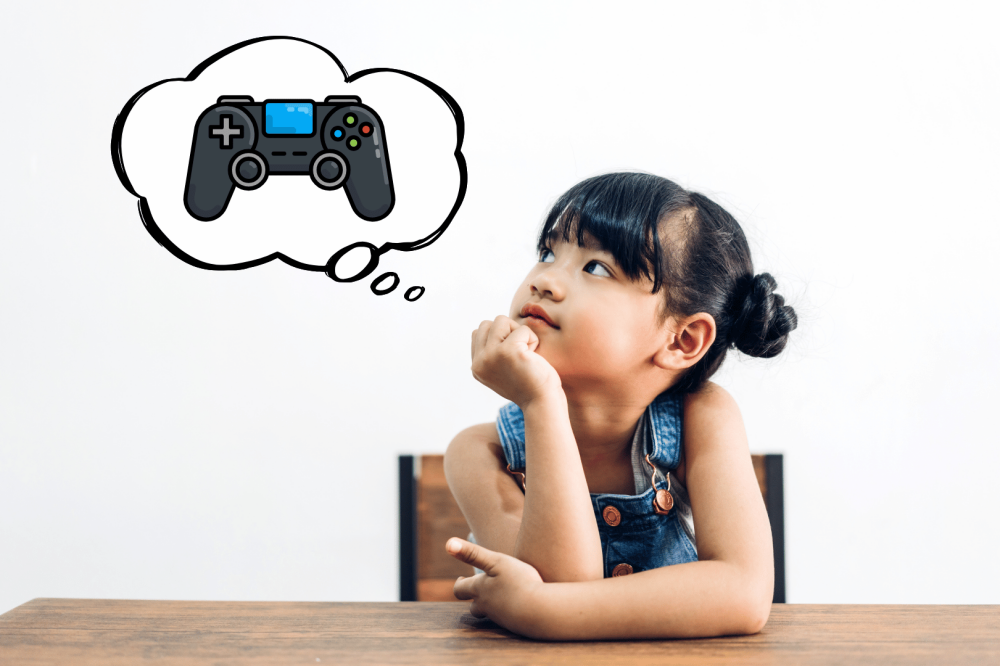 Little girl thinking about playing video games